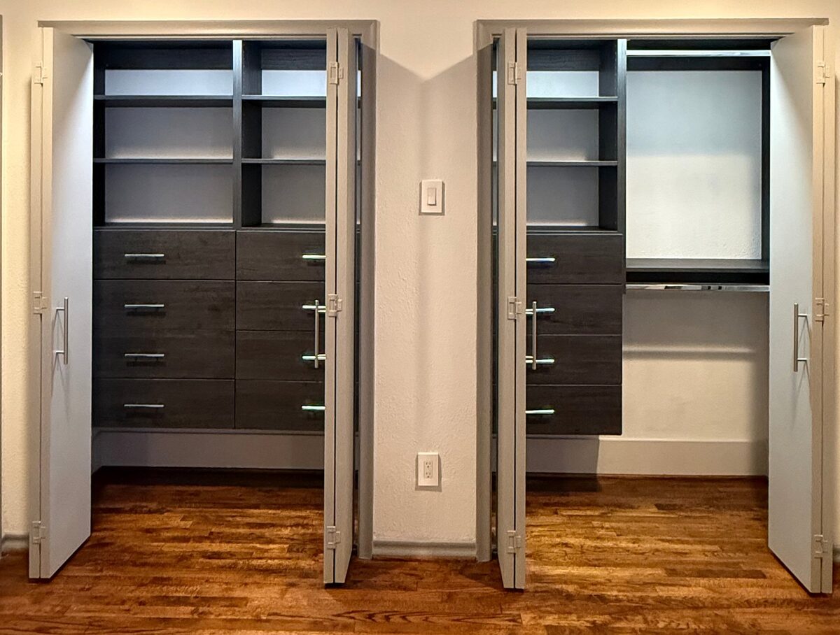 Matching dark wood reach-in closets with shelves and drawers