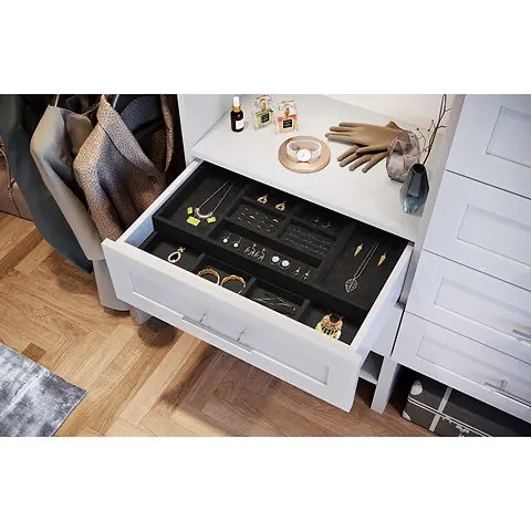 White jewelry tray insert with compartments and hardwood floor