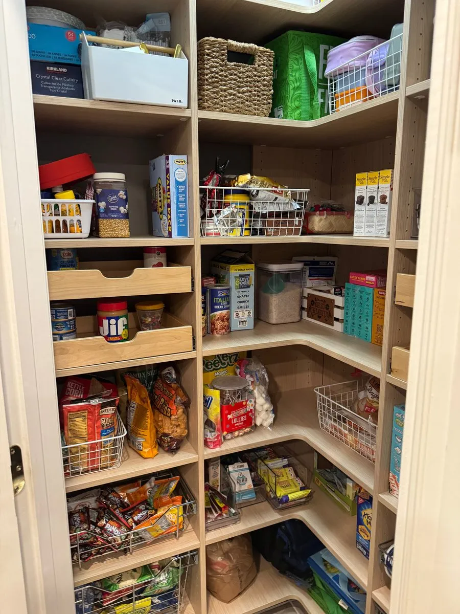 Corner pantry with adjustable shelves fully stocked