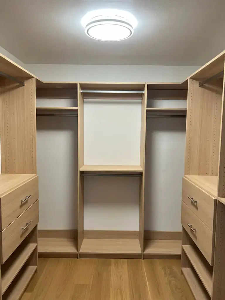 Warm light oak walk-in closet