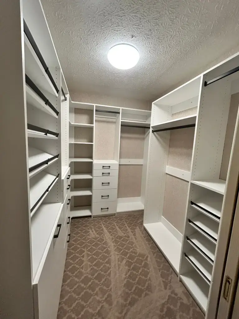 White walk-in with tiered shoe racks
